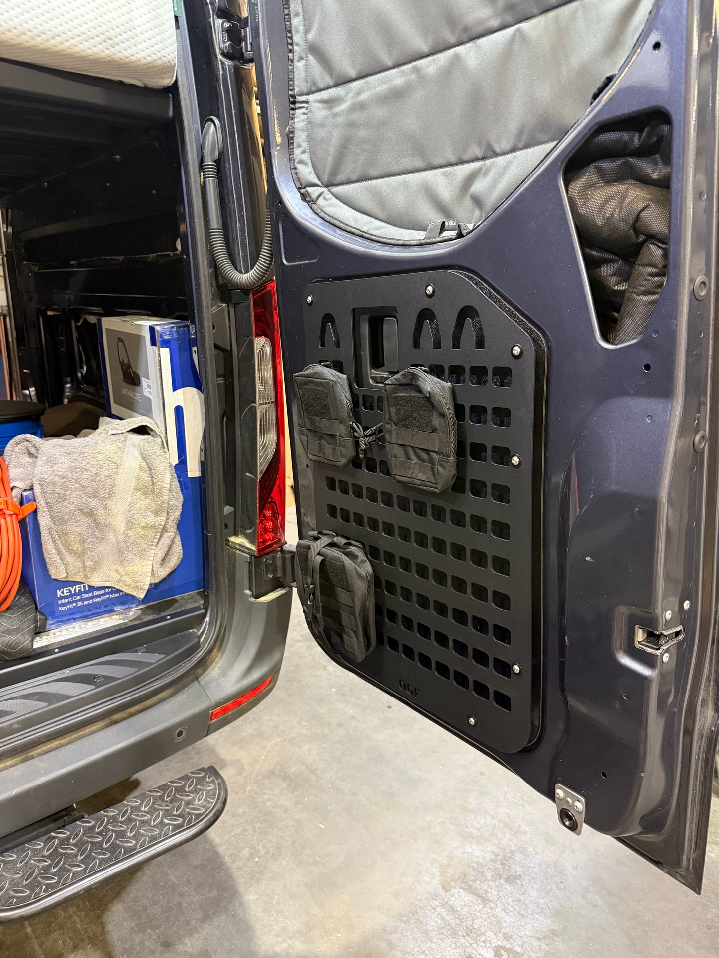 Mercedes Sprinter lower rear door MOLLE panel installed with storage pouches